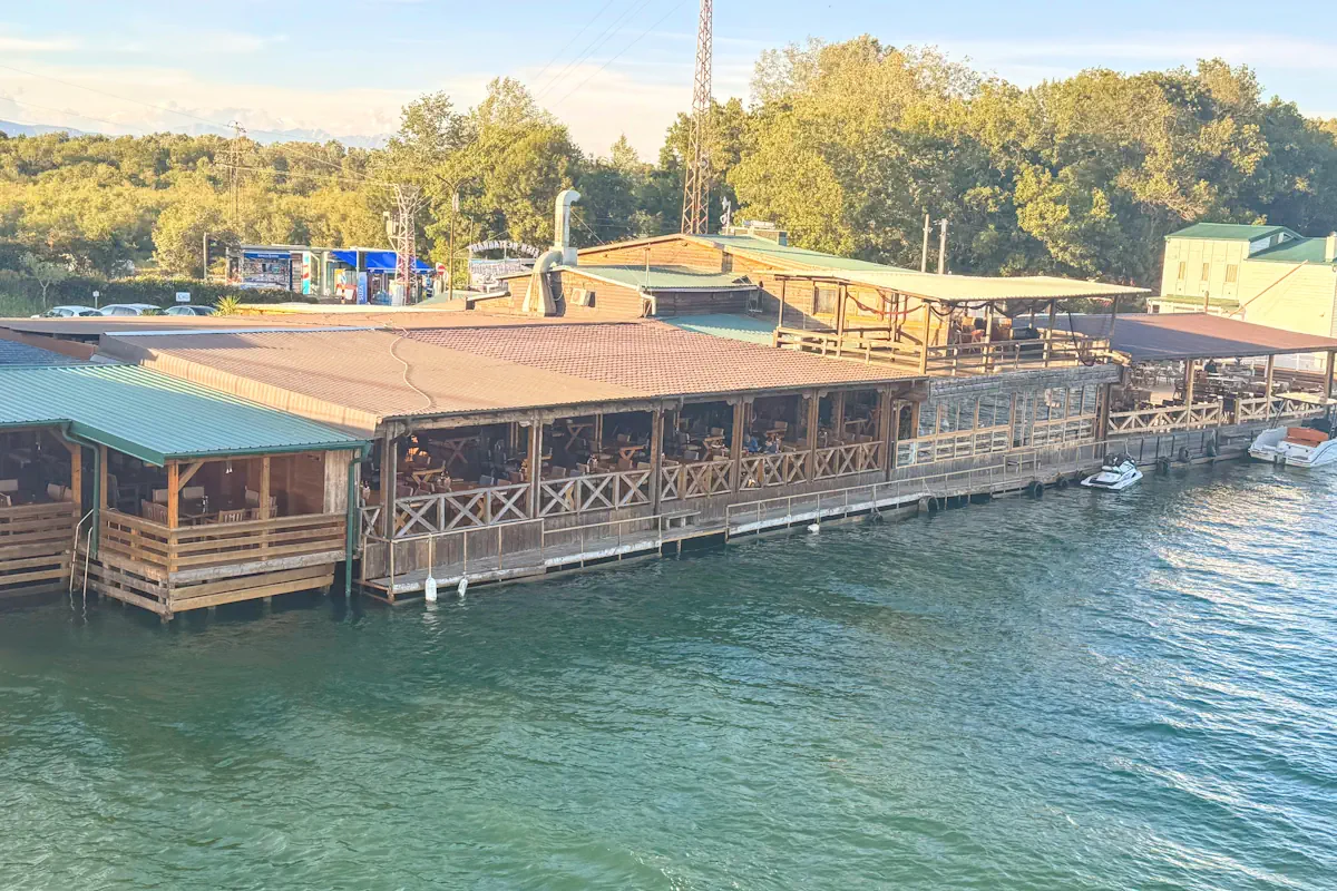 Traditional wooden stilt seafood restaurants on Ada Bojana River Montenegro