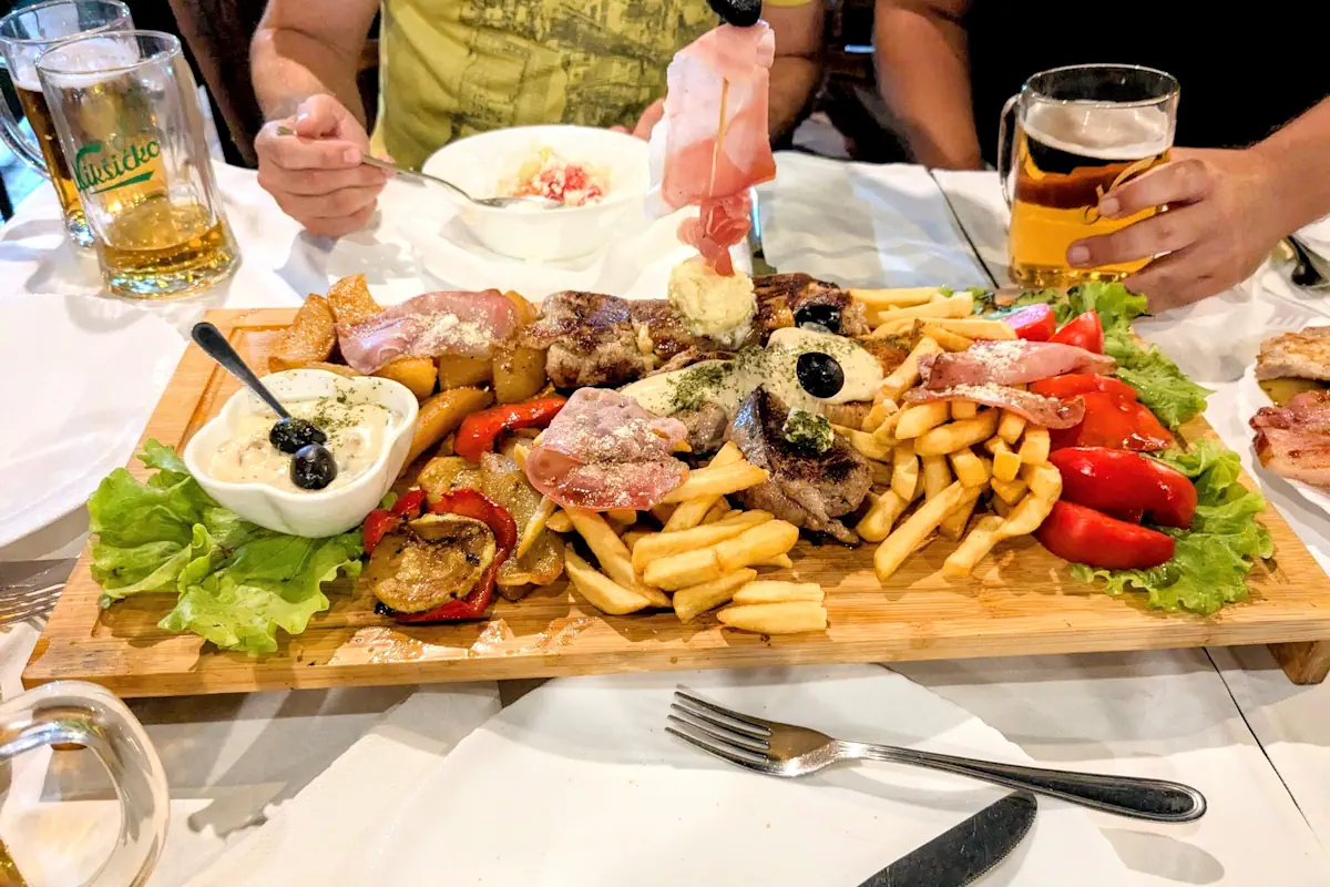 Rustic grilled meat platter at BBQ Tanjga Kotor