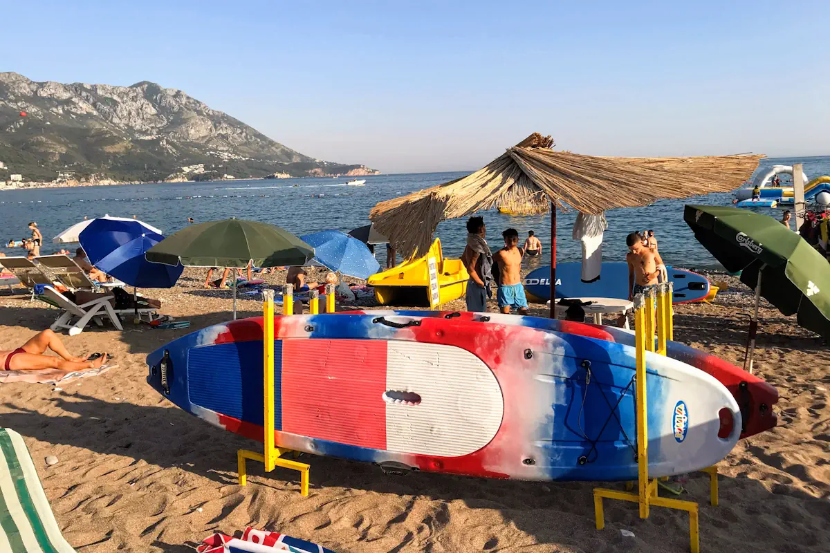 Becici Beach central part with SUP and kayak rentals
