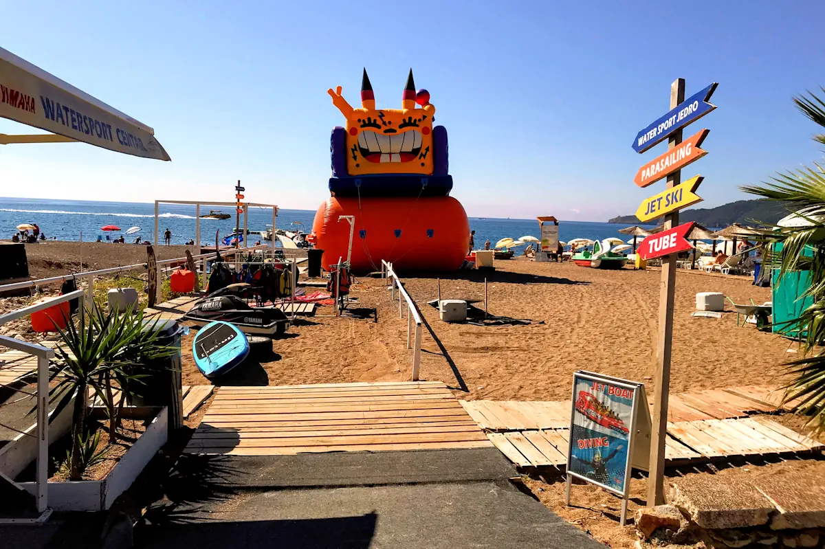 Stand up paddleboards and kayak rentals at the water sports stand on Becici Beach