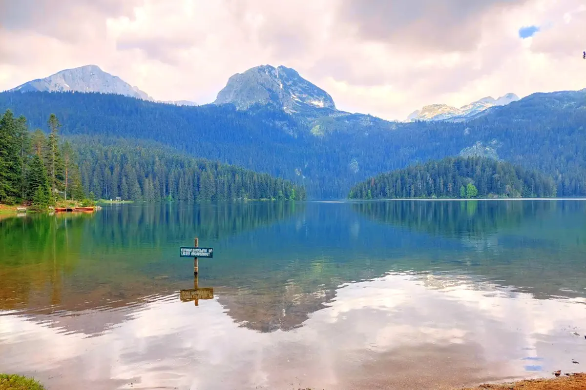 The reflection of Medjed peak in the dark waters of Black Lake in Montenegro