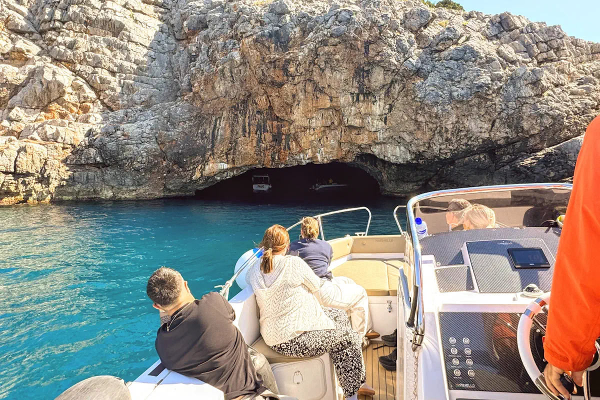 Boat approaching the low entryway of the Blue Cave