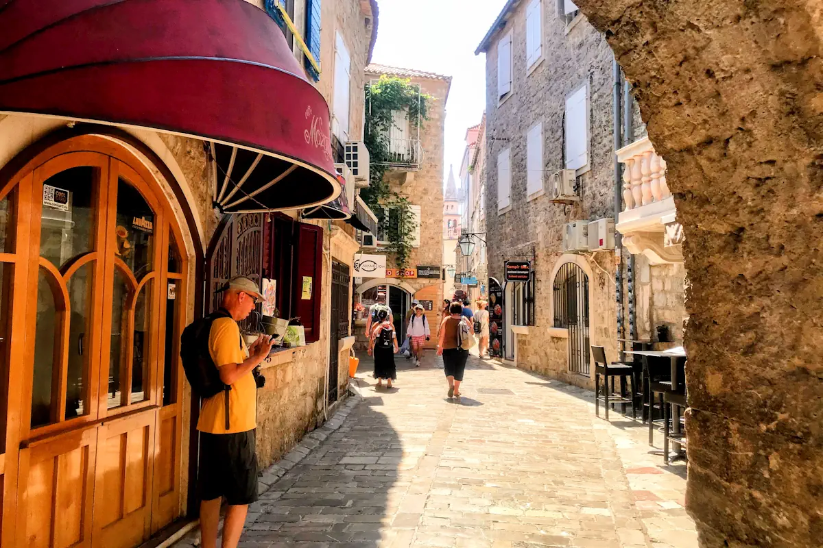 Walking through the Porta di Terra Ferma Main Old Town Gate, Budva