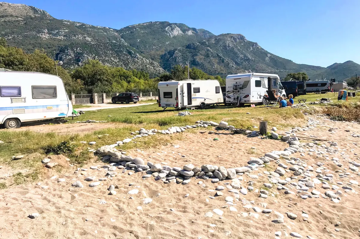 Buljarica Beach central part with parked camper vans