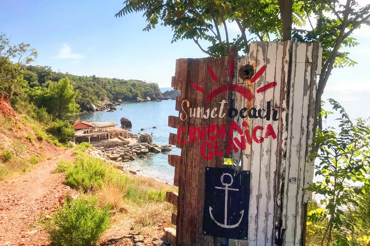The dramatic red cliffs and turquoise water of the Crvena Glavica nudist bays