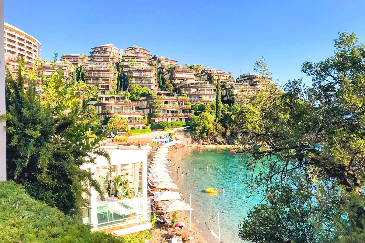 Dukley Beach on the Zavala Peninsula showing upscale sun loungers, SUPs for rent, and crystal clear waters