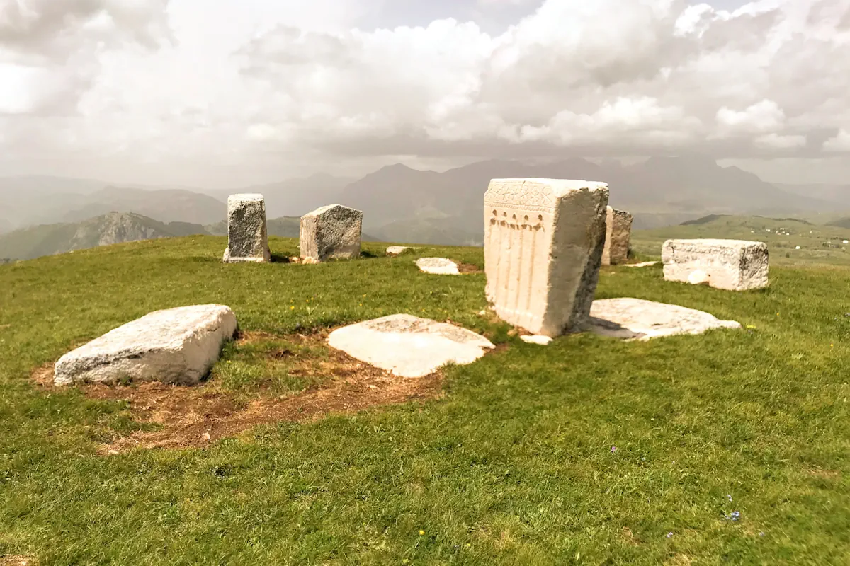 Stecci medieval tombstones on the Durmitor Ring passing through the iconic Sedlo pass in Montenegro