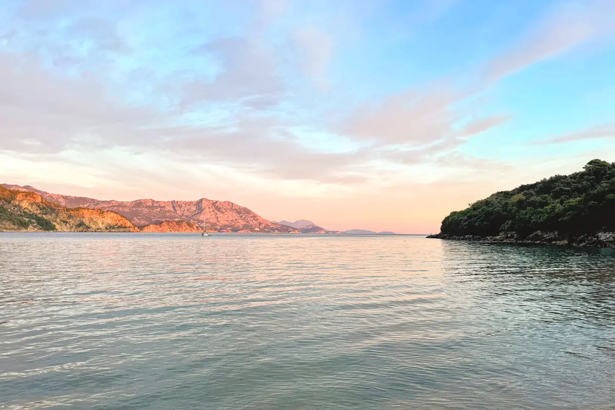 View from Jaz Beach during golden hour, overlooking Budva