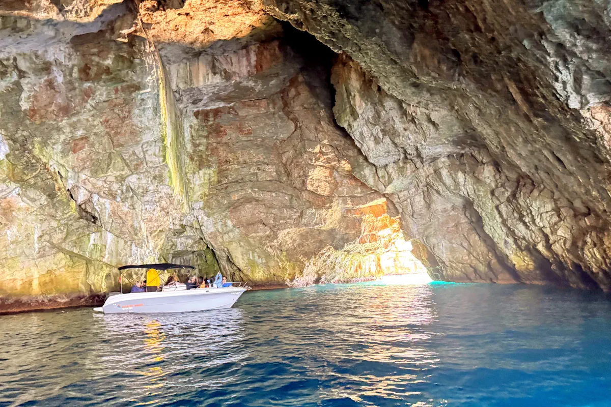 Speedboat inside the glowing blue waters of the Blue Cave in Montenegro