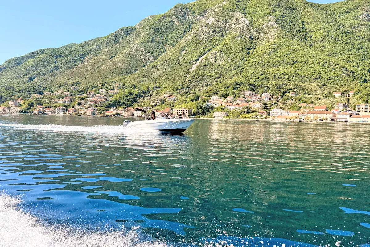 A private speedboat charter slicing through the water under the Montenegrin sun
