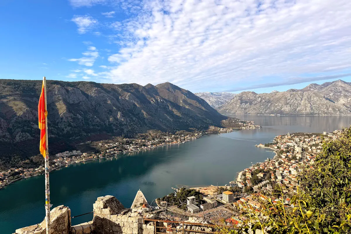 Aerial View of the orange roofs of Kotor's Old Town and the entrance to the Bay of Kotor