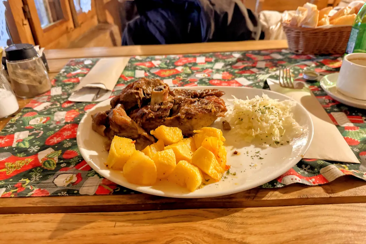 Traditional Montenegrin Sač dish with lamb and potatoes