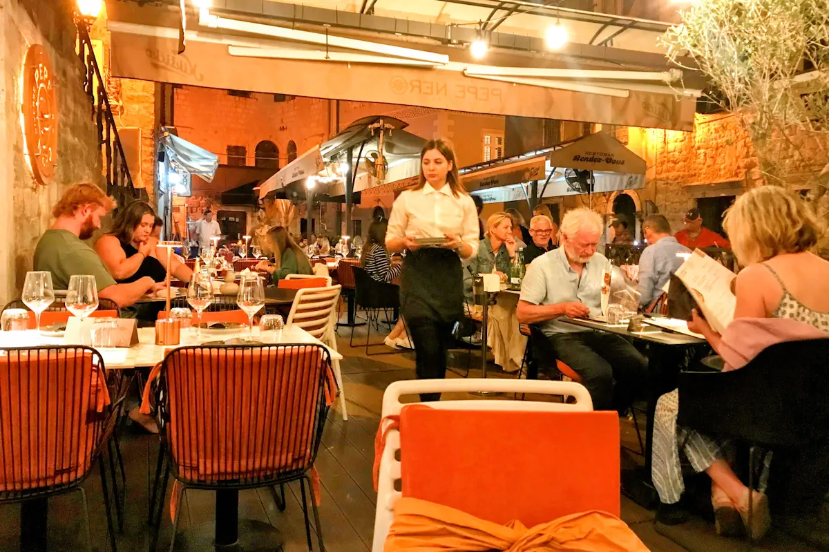 The Old Town Alleys of Kotor Illuminated at Night with golden lanterns