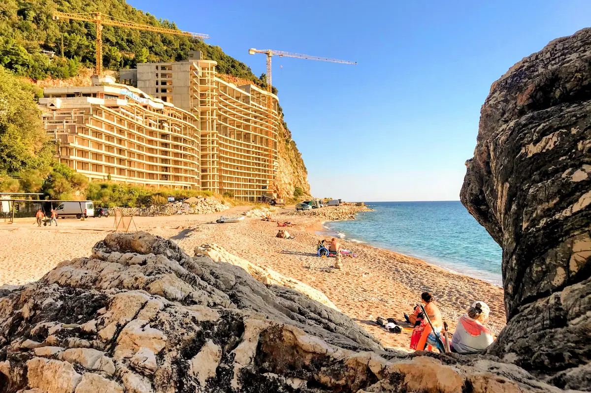 View of the southern End of Perazica Do Beach and the unfinished iconic Hotel AS skeleton