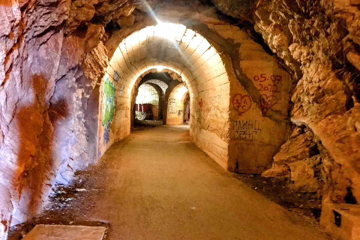 Hand-carved stone tunnel leading to Perazica Do Beach