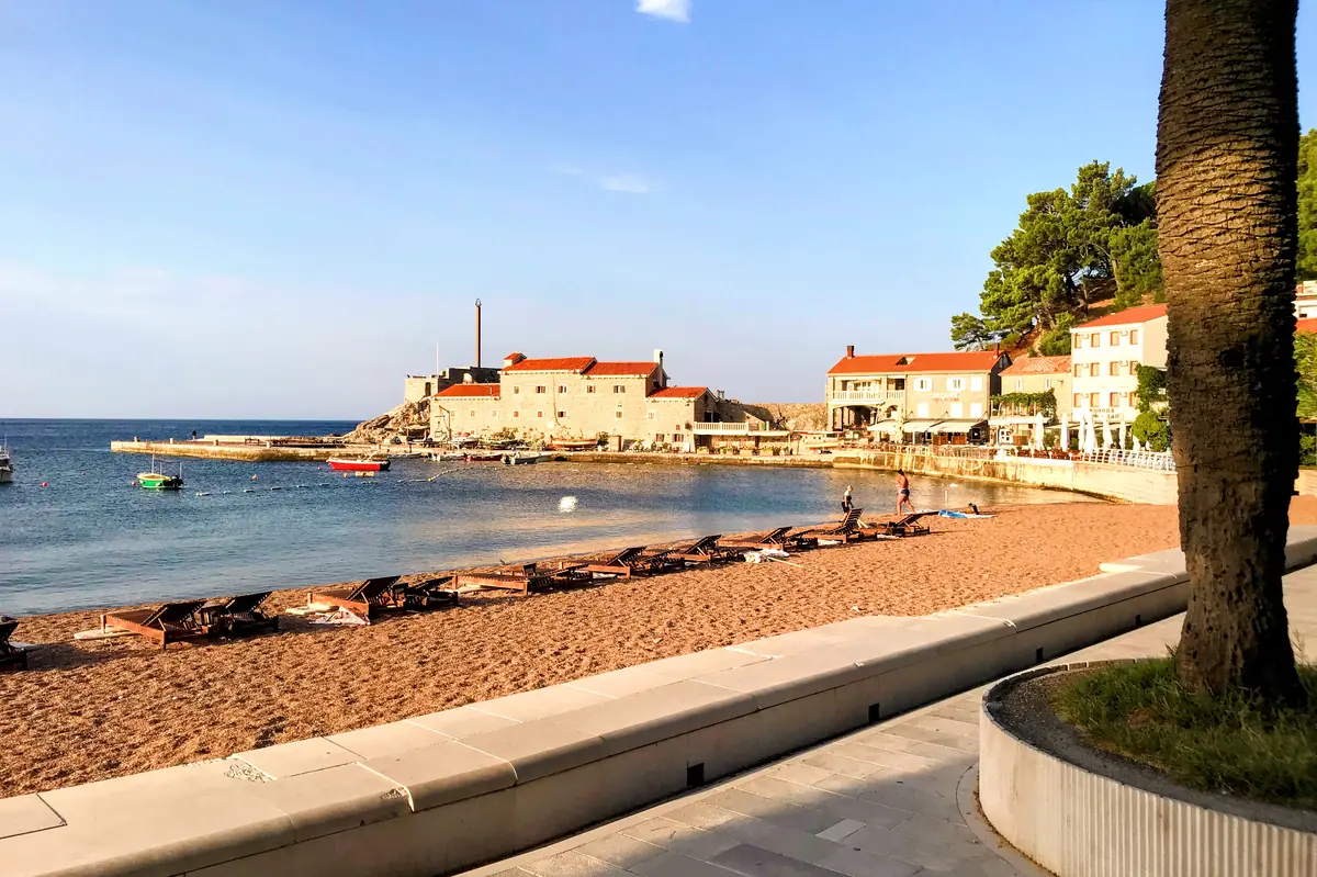 Petrovac Town Beach Panorama with Kastio the marina in the background