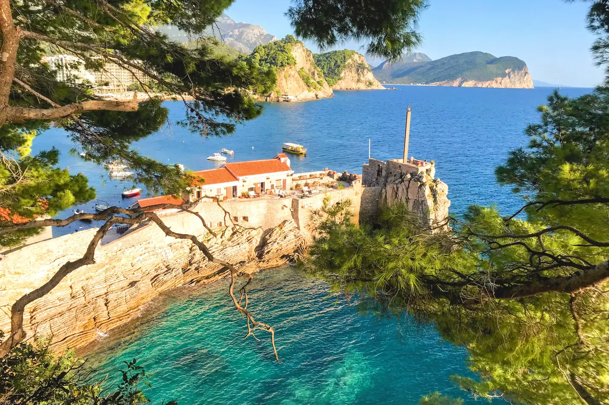 Kastio Fortress with war memorial and quarantine building in Petrovac, photo taken from health trail towards Perazica Do