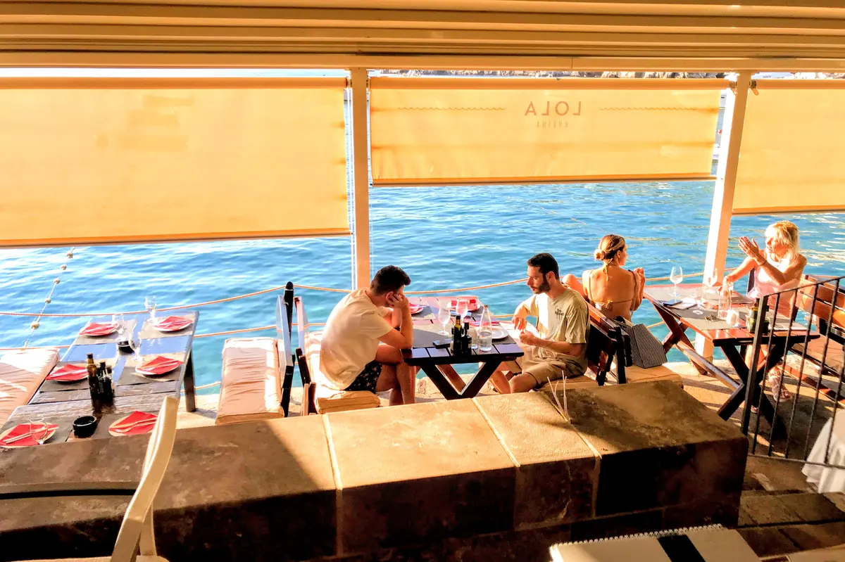 Prno Beach Seafood Restaurant during the day and sunshades