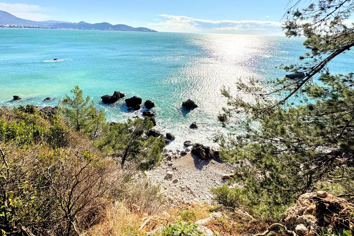 Ratac Beach northern end with large boulders, overlooking the coastal town of Bar
