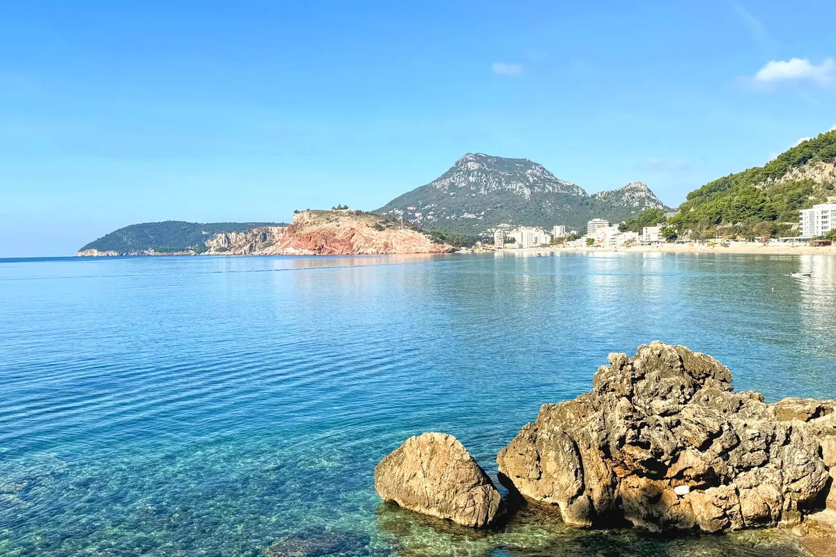Sutomore beach with lively crowds and seaside backdrop