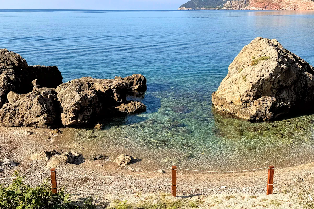 Secluded rocky swimming inlet cove near Sutomore