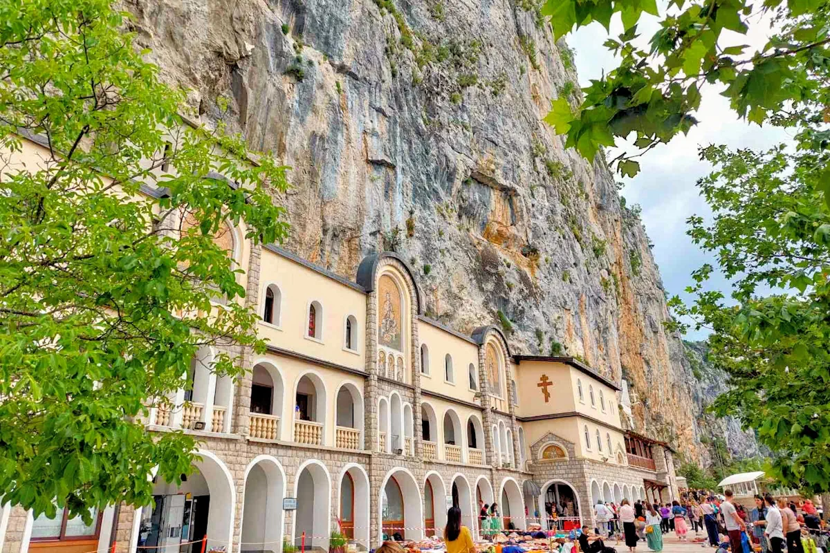 Upper Ostrog Monastery carved into a vertical cliff face in Danilovgrad, Montenegro