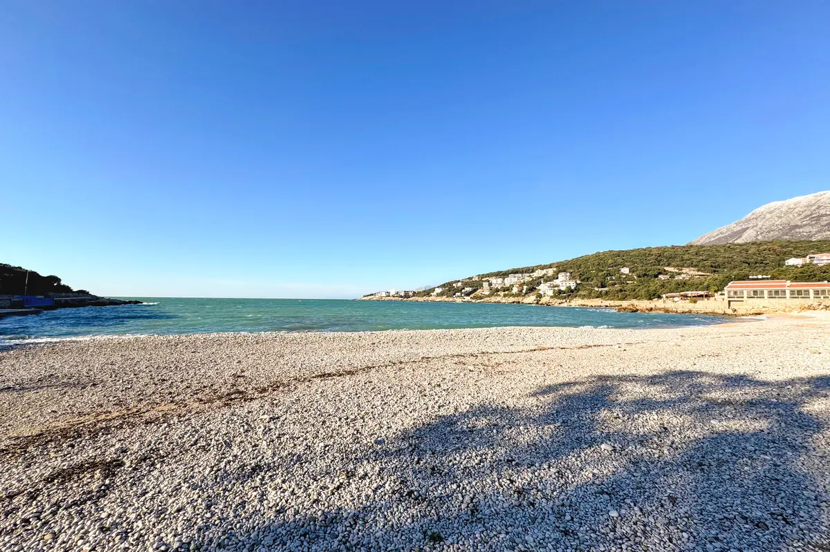 Utjeha Beach, the bay of olives, with turquoise water and social promenade
