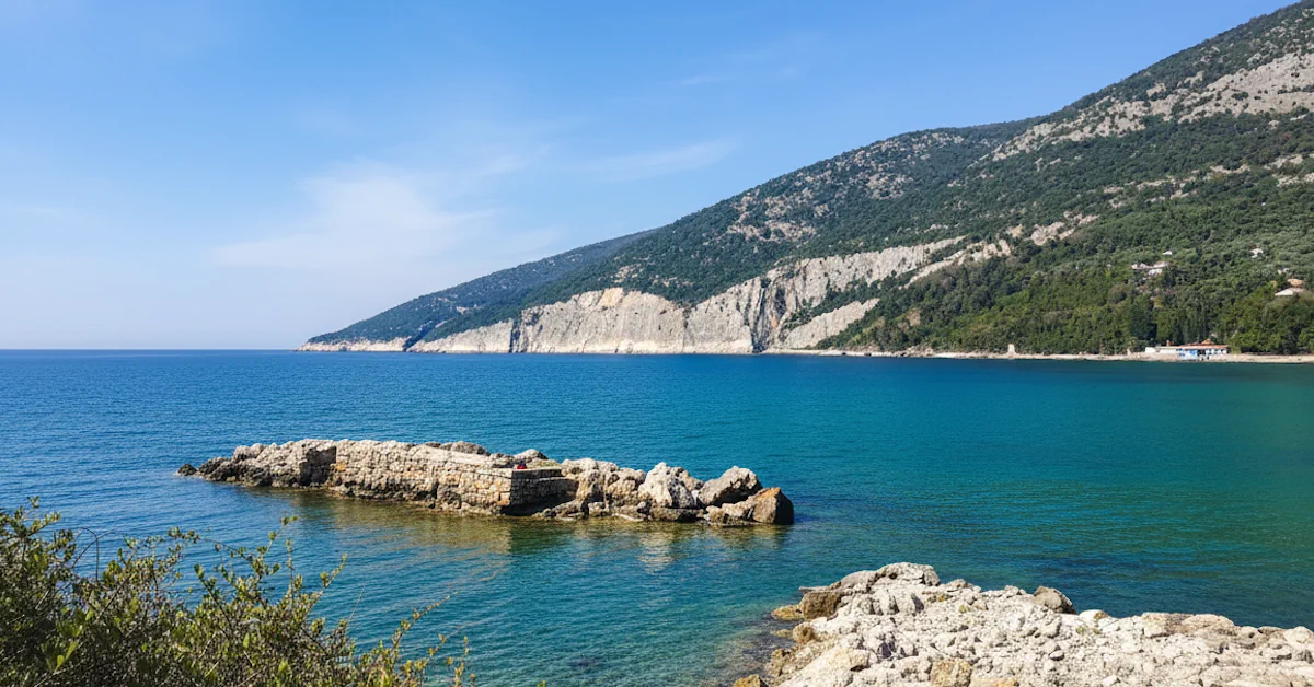 The sharp cliffs and crystal clear waters of Valdanos Nudist Beach
