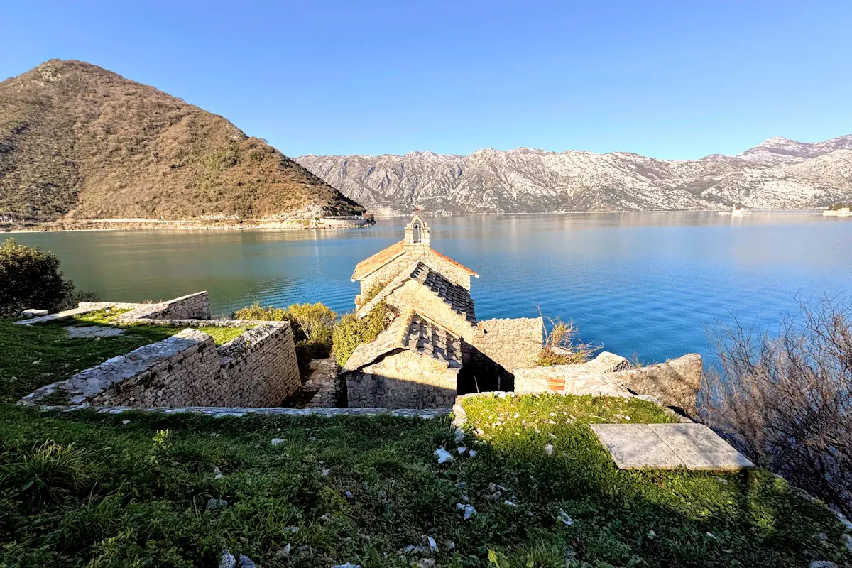 Historic stone church overlooking Verige Beach and the Boka Bay strait near Tivat