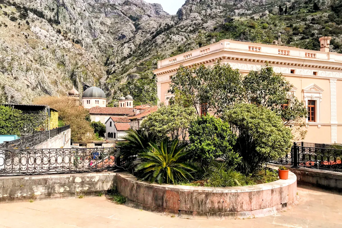 View of Kotor Old Town, St. Nicholas' Church and the surrounding mountain range from the top of Kampana Tower