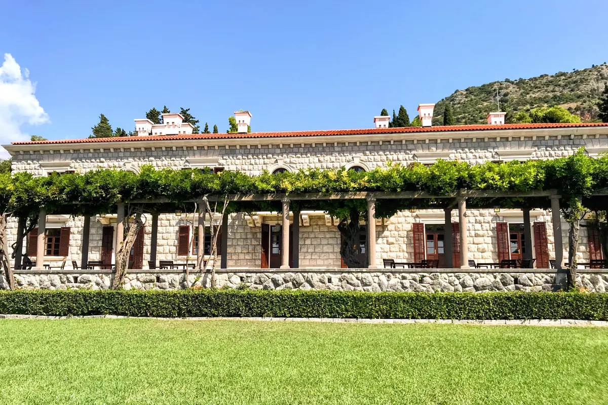 Villa Milocer with its iconic vine-covered pergola and terrace