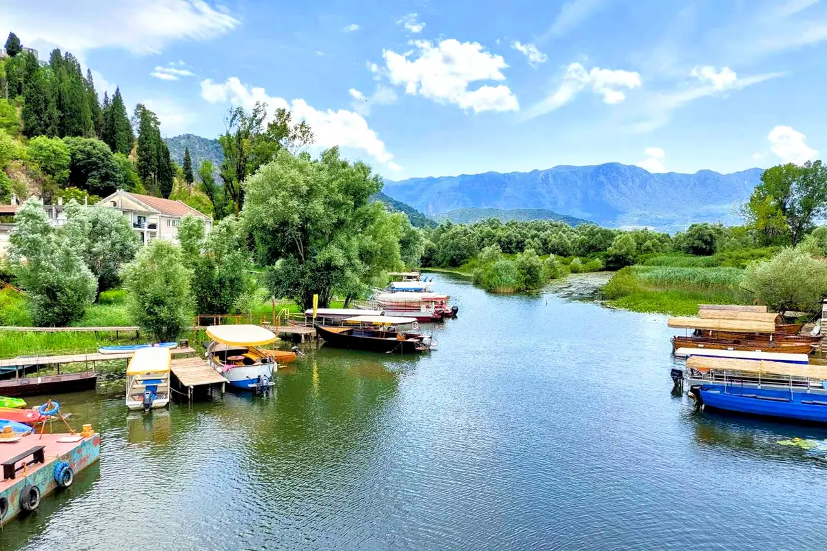  panorama of the Virpazar harbor entrance with Traditional Cun Boats