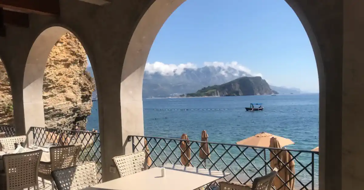 View of Sveti Nikola Island from the Mogren II Beach Restaurant, near Budva Old Town