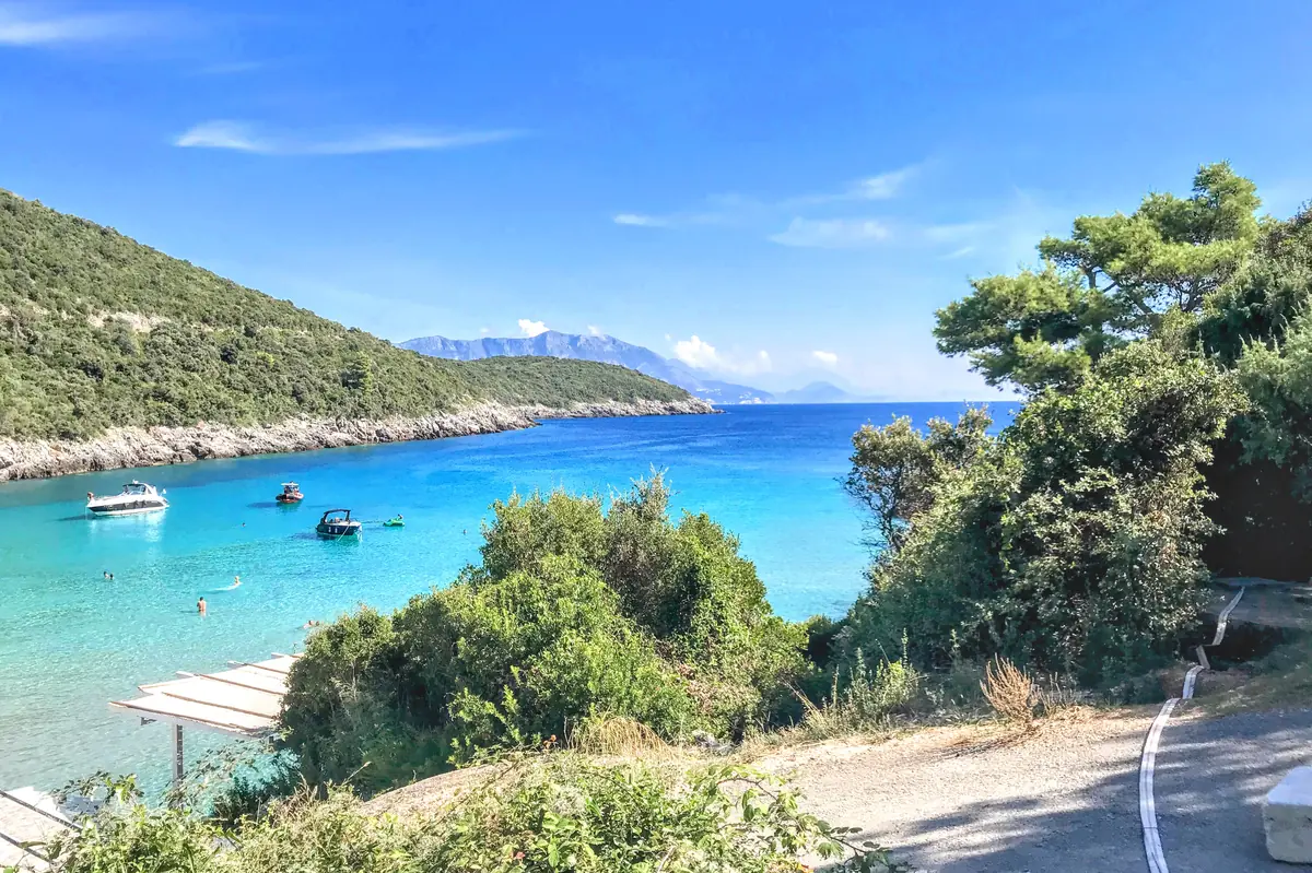 View of Trsteno Beach turquoise waters from the cliffs with Budva coastline in the background, Montenegro