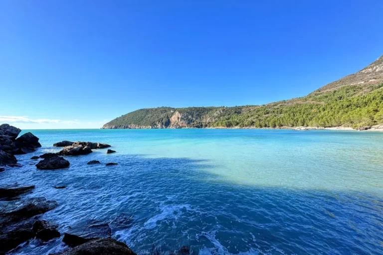 Maljevik beach near Sutomore with bolders overlooking turquoise colored waters and the black cape