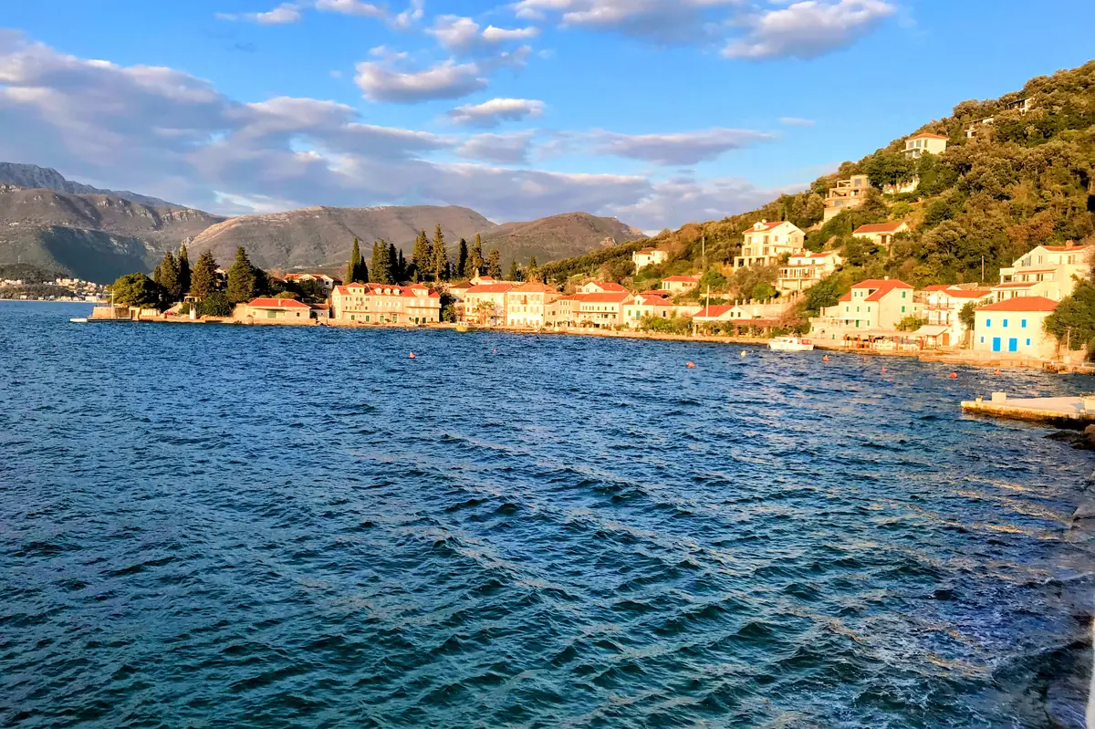 Rose Montenegro view of the harborfront with sea captain's houses and boats