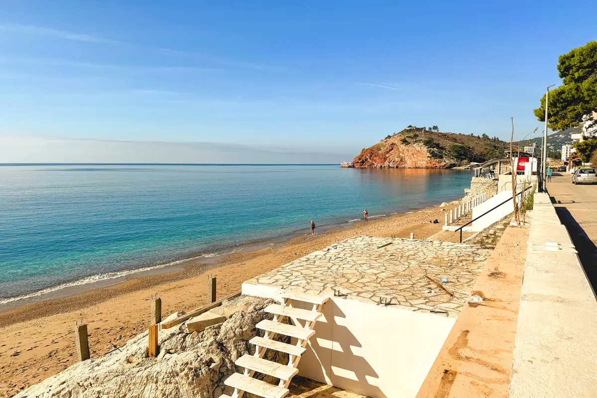 Sutomore Beach near Bar overlooking the golden pebbles and the red cliffs