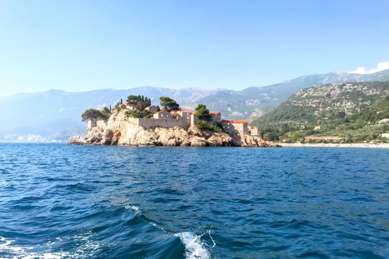 View of Sveti Stefan island and Southern Beach from a boat