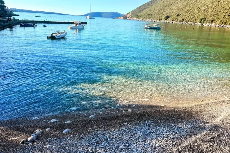 Zanjice Beach on the Lustica Peninsula left/southern end overlooking the gin-clear waters and Mamula Island