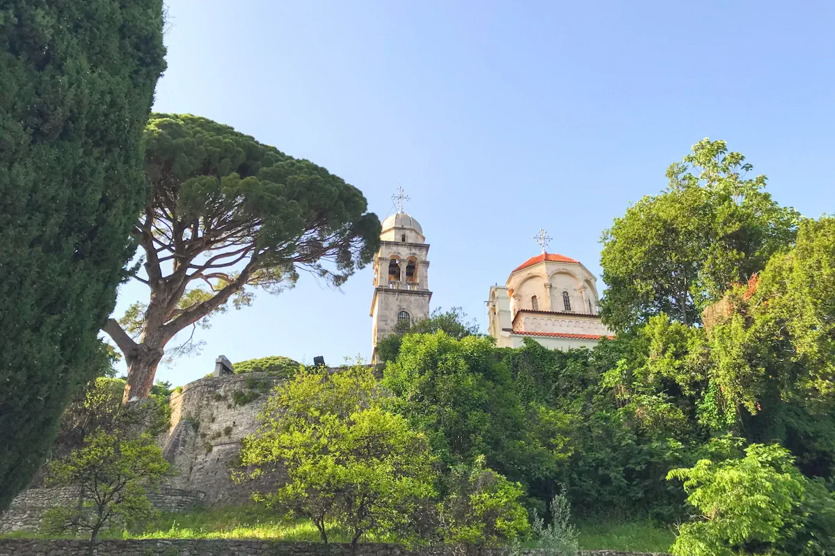 The Serbian Orthodox Savina Monastery in Herceg Novi, featuring 18th-century Baroque architecture and panoramic views of the Bay of Kotor.