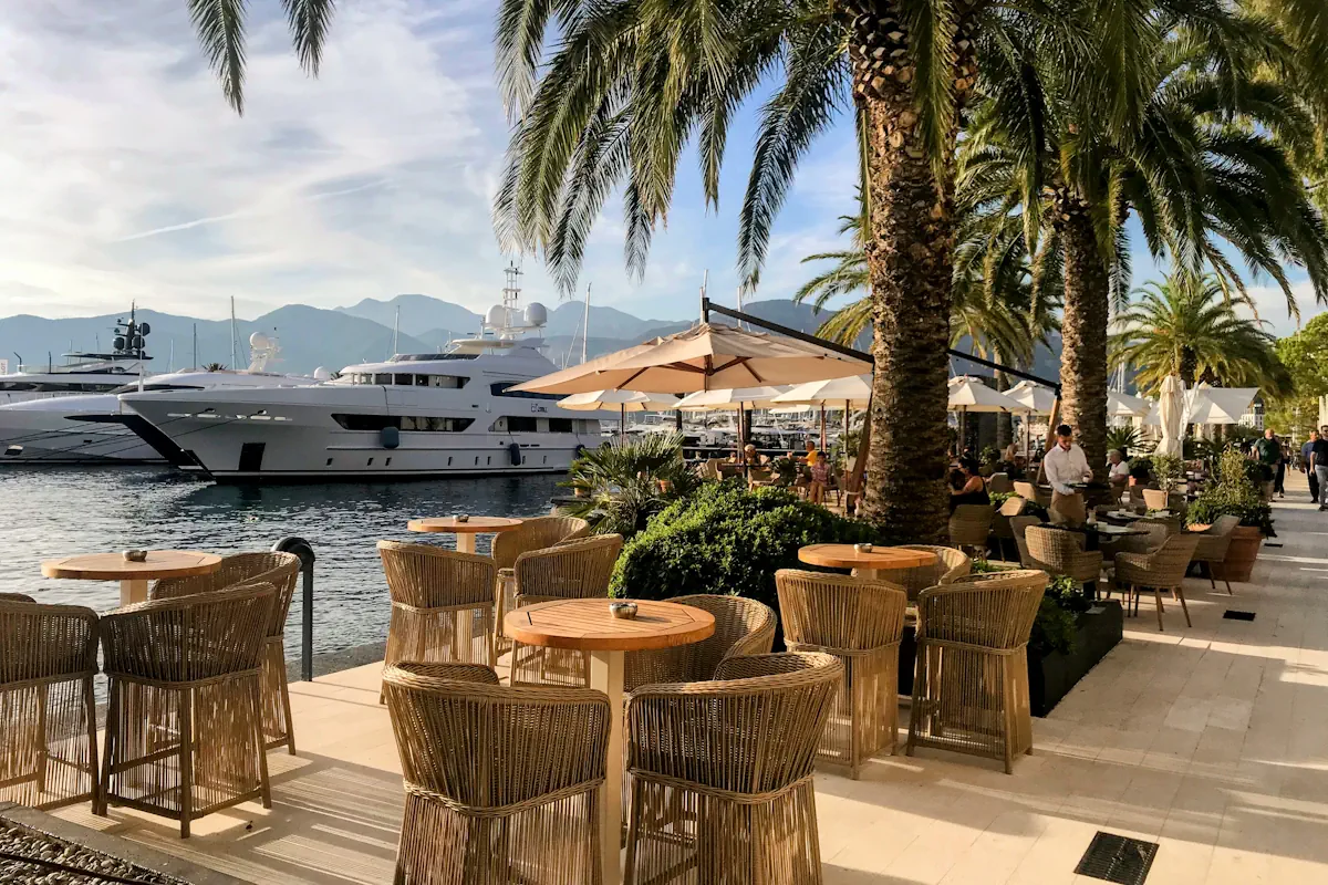 Fine dining table setup at a luxury restaurant in Porto Montenegro overlooking the yacht marina.