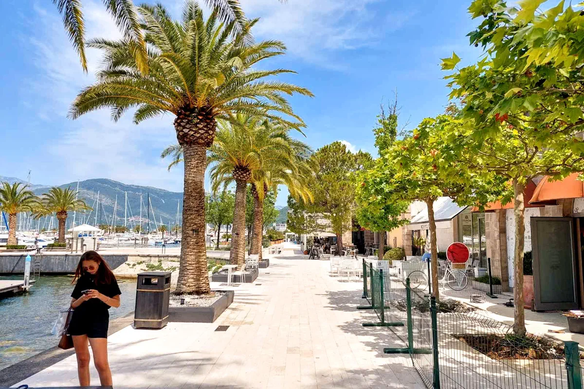 Girl walking along the waterfront of Porto Montenegro, Tivat