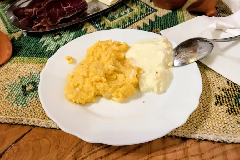 Authentic Montenegrin smočani kačamak, a hearty dish of pounded potatoes, cheese, and kajmak.