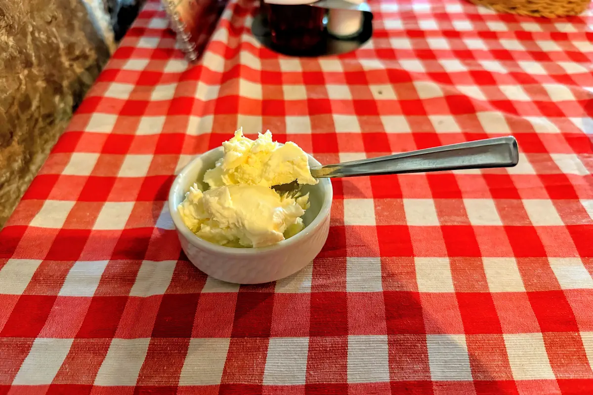Traditional Montenegrin kajmak served in a small bowl, a rich salted cream cheese popular across the Balkans.