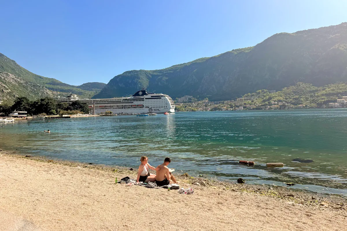 Main Urban Beach in Kotor overlooking the Bay and a cruise ship