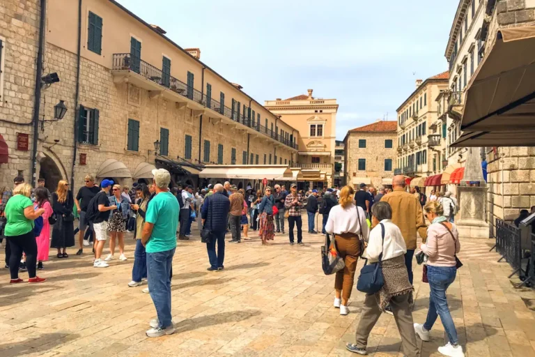 The busy historic Square of Arms in Kotor's Old Town, the central hub where the winter and summer carnivals begin.