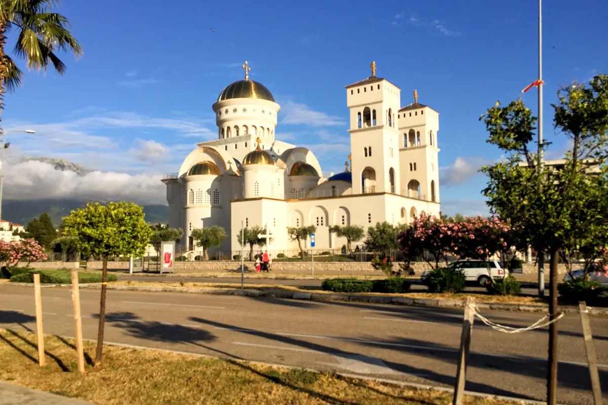 The golden domes and white exterior of the Cathedral of Saint Jovan Vladimir in the center of Bar, Montenegro.