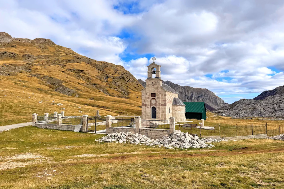 The stone Church of St. Elijah overlooking the Lukavica plateau near Kapetanovo Lake, a top destination for hiking and nature in Montenegro.
