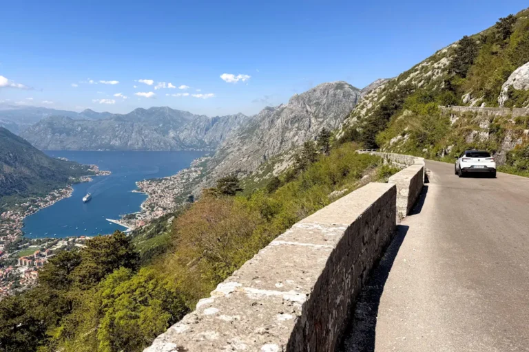 Rental Car driving the 25-bend Kotor Serpentine Road