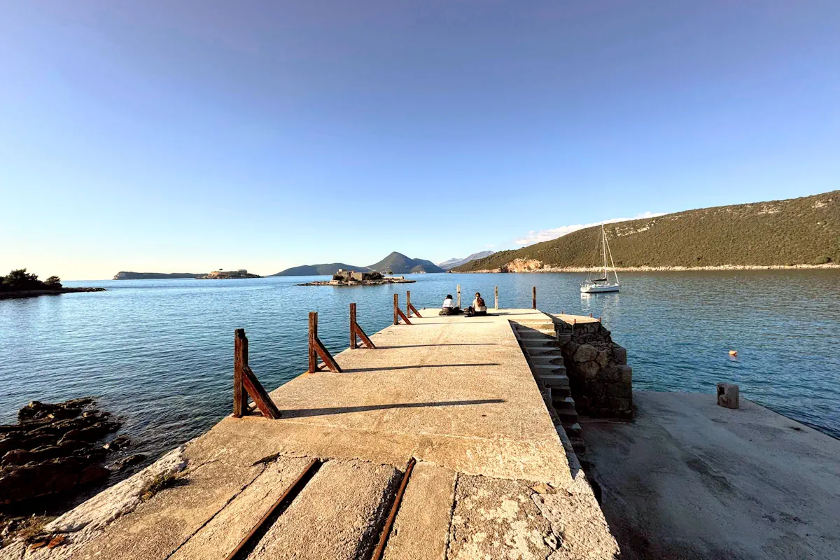 The pier to the right side of Arza Beach overlooking crystal-clear Adriatic near Miriste and Zanjice on the Lustica Peninsula, Montenegro
